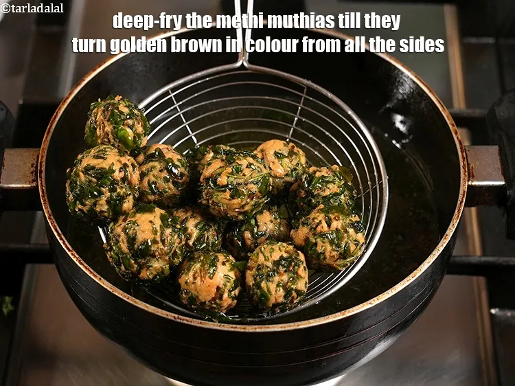 Step 21 – <p>Deep-fry the methi muthias till they turn golden brown in colour from all the sides.</p>