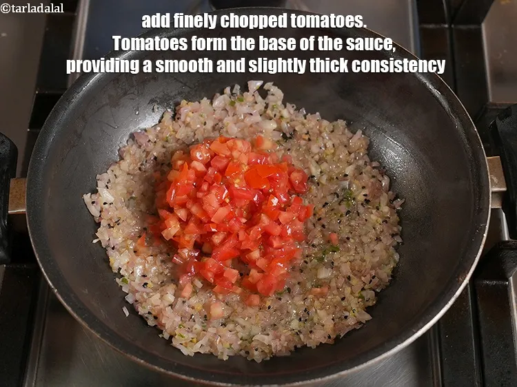 Step 29 – <p>Add ½ cup finely <a href="https://www.tarladalal.com/glossary-chopped-tomatoes-779i">chopped tomatoes</a>. Tomatoes form the base of the sauce, providing …