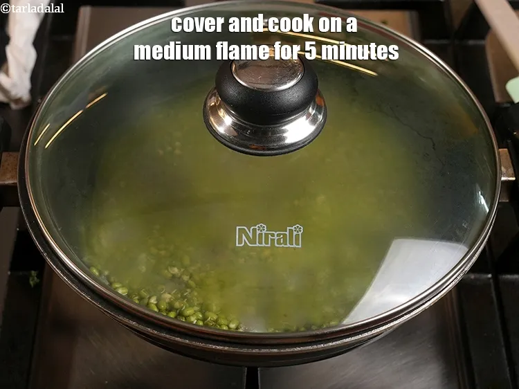 Step 30 – <p>Cover and cook on a medium flame for 5 minutes, while stirring occasionally.</p>