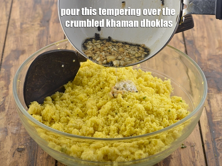 Step 5 – <p>Pour this tempering over the crumbled khaman dhoklas.</p>