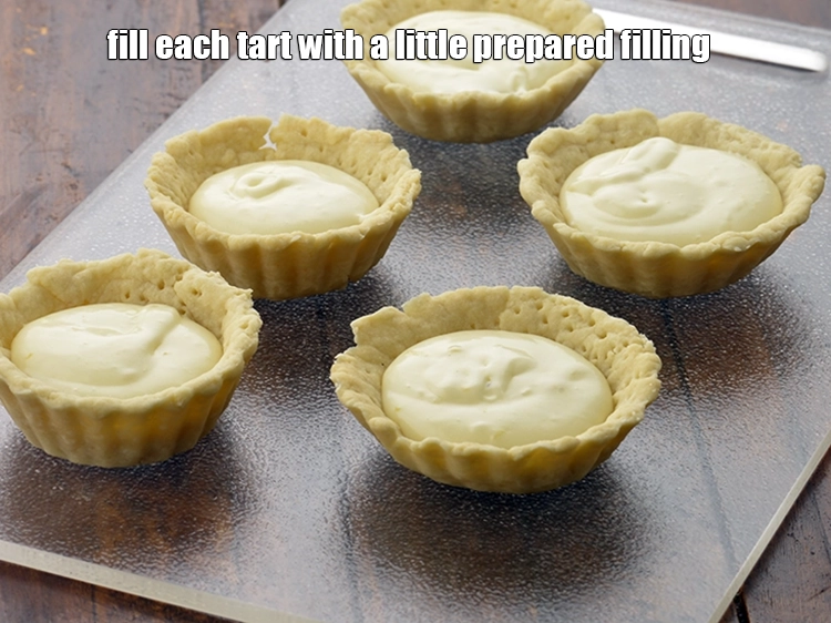 Step 3 – <p><span style="background-color:rgb(255,255,255);color:rgb(0,0,0);">Just before serving, fill each </span><a href="https://www.tarladalal.com/eggless-tarts-1135r"><strong><u>tarts</u></strong></a><span style="background-color:rgb(255,255,255);color:rgb(0,0,0);"> with a little prepared filling.</span></p>