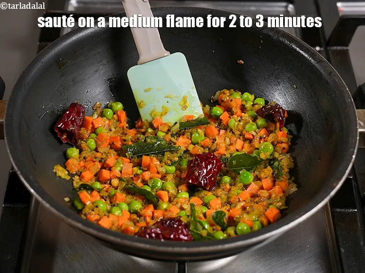 Step 22 – <p><span style="background-color:rgb(255,255,255);color:rgb(0,0,0);">Sauté on a medium flame for 2 to 3 minutes, while stirring occasionally.</span></p>