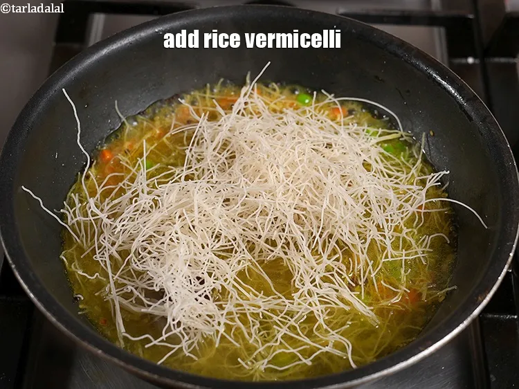 Step 24 – <p><span style="background-color:rgb(255,255,255);color:rgb(0,0,0);">Add 1½ cups of </span><a href="https://www.tarladalal.com/glossary-rice-vermicelli-chawal-ki-seviyan-1202i"><u>rice vermicelli (seviyan)</u></a><u>.</u></p>