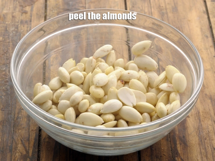 Step 3 – <p><span style="background-color:rgb(255,255,255);color:rgb(0,0,0);">Peel the </span><a href="https://www.tarladalal.com/glossary-almonds-badam-378i"><u>almond (badam)</u></a><span style="background-color:rgb(255,255,255);color:rgb(0,0,0);">.</span></p>