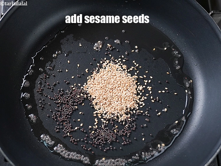 Step 19 – <p>Add <span style="background-color:rgb(255,255,255);color:rgb(0,0,0);">1 tsp </span><a href="https://www.tarladalal.com/glossary-sesame-seeds-til-gingelly-seeds-612i"><u>sesame seeds (til)</u></a>. These add a nice crunch in the …