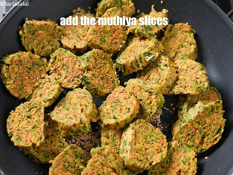 Step 22 – <p>Add the <strong>Indian style steamed muthia</strong> pieces.&nbsp;</p>