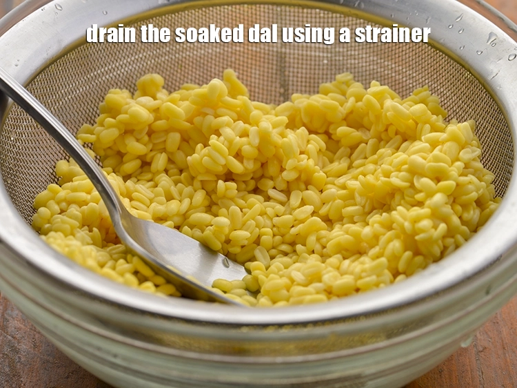 Step 4 – <p>Drain the soaked dal using a strainer.</p>