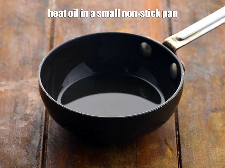 Step 19 – <p>For the tempering of&nbsp;<strong>Moong Dal Dhokla</strong>, heat the <span style="background-color:rgb(255,255,255);color:rgb(0,0,0);">1 tbsp </span><a href="https://www.tarladalal.com/glossary-oil-671i"><u>oil</u></a> in a …