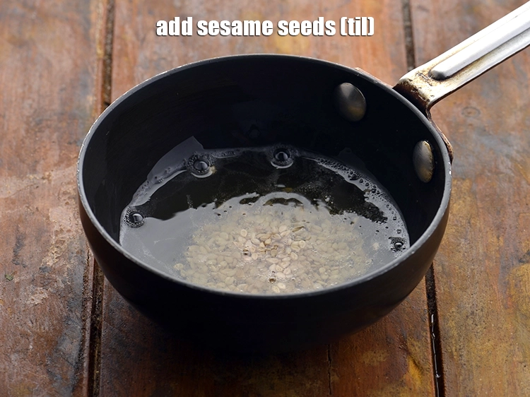 Step 21 – <p>When the mustard seeds crackle, add the <span style="background-color:rgb(255,255,255);color:rgb(0,0,0);">1/2 tsp </span><a href="https://www.tarladalal.com/glossary-sesame-seeds-til-gingelly-seeds-612i"><u>sesame seeds (til)</u></a>.</p>