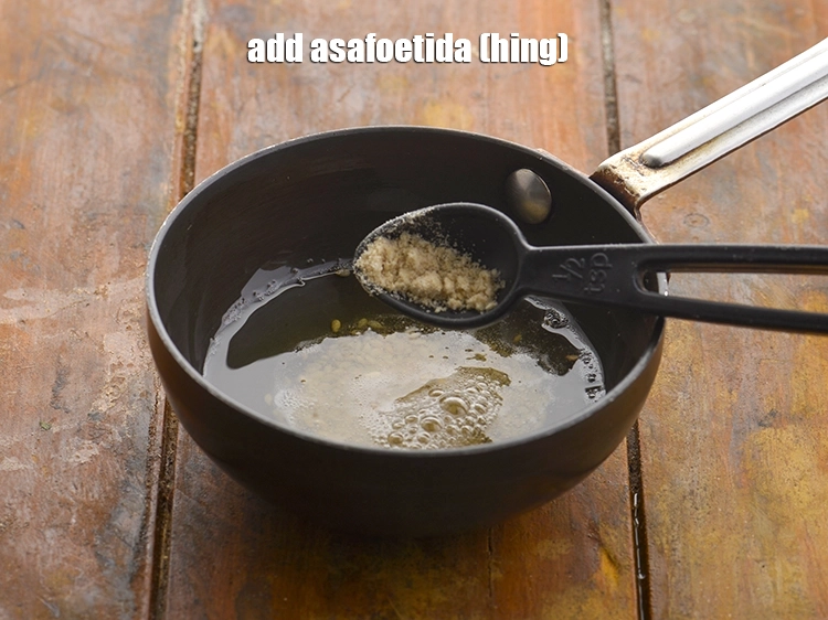 Step 22 – <p>Add the <span style="background-color:rgb(255,255,255);color:rgb(0,0,0);">a pinch </span><a href="https://www.tarladalal.com/glossary-asafoetida-hing-113i"><u>asafoetida (hing)</u></a> and sauté on a medium flame for …