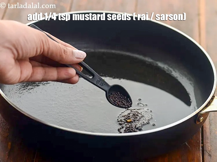 Step 2 – <p>Add <span style="background-color:rgb(255,255,255);color:rgb(0,0,0);">1/4 tsp </span><a href="https://www.tarladalal.com/glossary-mustard-seeds-sarson-rai-sarson-ke-beej-525i"><u>mustard seeds ( rai / sarson)</u></a><u>.</u></p>