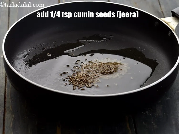 Step 3 – <p>Add the <span style="background-color:rgb(255,255,255);color:rgb(0,0,0);">1/4 tsp </span><a href="https://www.tarladalal.com/glossary-cumin-seeds-jeera-zeera-381i"><u>cumin seeds (jeera)</u></a><u>.</u></p>
