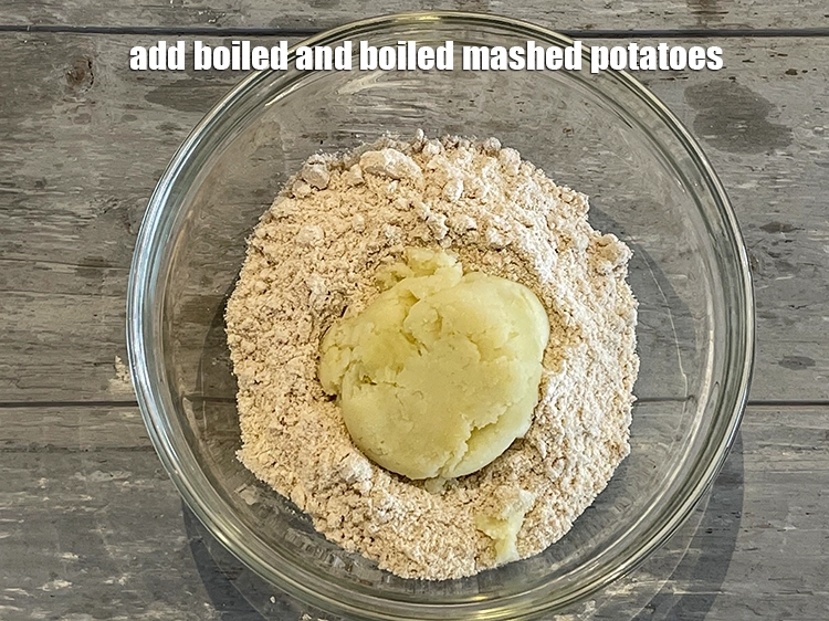 Step 11 – <p>Add 1/4 cup <span style="background-color:rgb(255,255,255);color:rgb(0,0,0);">peeled and </span><a href="https://www.tarladalal.com/glossary-potatoes-aloo-alu-batata-710i#ing_2516"><u>boiled and mashed potatoes</u></a><u>.</u></p>