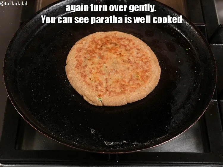 Step 28 – <p><span style="color:rgb(0,0,0);">Again turn over gently. You can see the </span><strong>rajgira paneer paratha&nbsp;|&nbsp;farali paratha recipe&nbsp;|&nbsp;vrat ka …