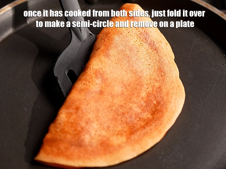 Step 16 – <p>Once it has cooked from both sides, just fold it over to make a semi-circle …
