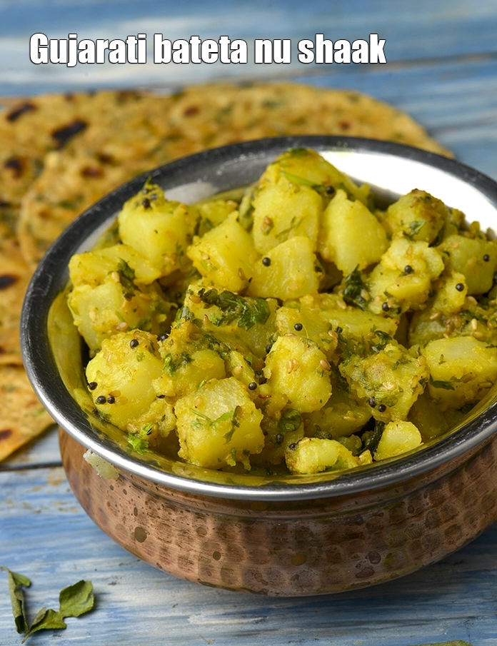 Step 20 – <p>Serve&nbsp;<strong>Batata Nu Shaak (Bateta Nu Shaak)</strong>&nbsp;with <a href="https://www.tarladalal.com/Gujarati-Dal-(-Gujarati-Recipe)-612r">Gujarati Dal</a>, <a href="https://www.tarladalal.com/Rice-Cooked-Rice-4800r">Rice </a>and <a href="https://www.tarladalal.com/Methi-Thepla-Thepla-Recipe-Without-Curds-for-Traveller-40726r">Thepla</a>.&nbsp;</p>
