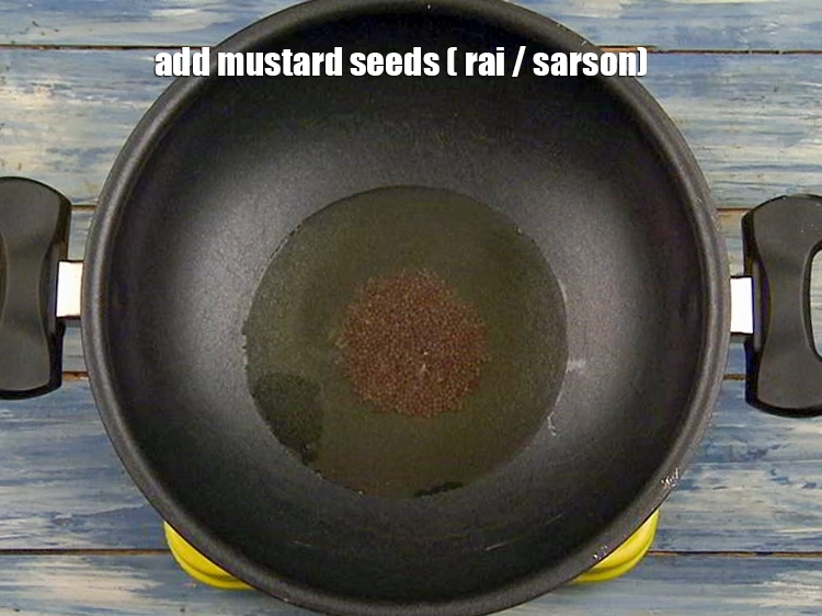 Step 8 – <p>Add <span style="background-color:rgb(255,255,255);color:rgb(0,0,0);">1 tsp </span><a href="https://www.tarladalal.com/glossary-mustard-seeds-sarson-rai-sarson-ke-beej-525i"><u>mustard seeds ( rai / sarson)</u></a> and let it crackle.</p>