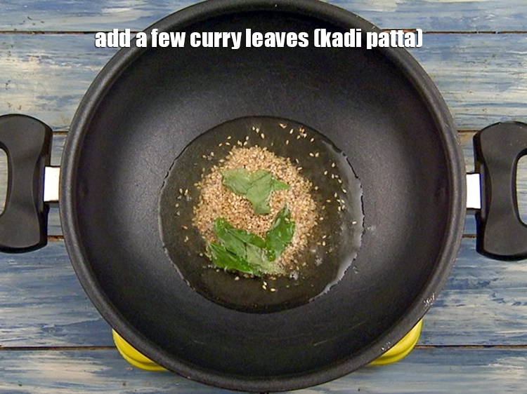 Step 10 – <p>Add <span style="background-color:rgb(255,255,255);color:rgb(0,0,0);">a few </span><a href="https://www.tarladalal.com/glossary-curry-leaves-kadi-patta-kadipatta-388i"><u>curry leaves (kadi patta)</u></a>.</p>
