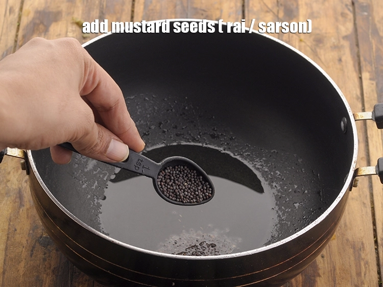 Step 18 – <p><span style="background-color:rgb(255,255,255);color:rgb(0,0,0);">Once the oil is hot, add 1 tsp </span><a href="https://www.tarladalal.com/glossary-mustard-seeds-sarson-rai-sarson-ke-beej-525i"><u>mustard seeds ( rai / …