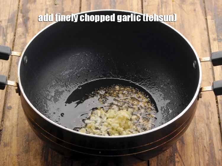 Step 22 – <p><span style="background-color:rgb(255,255,255);color:rgb(0,0,0);">When the seeds crackle, add 2 tsp finely </span><a href="https://www.tarladalal.com/glossary-garlic-lehsun-lahsun-348i#ing_2370"><u>chopped garlic (lehsun)</u></a><span style="background-color:rgb(255,255,255);color:rgb(0,0,0);">.</span></p>