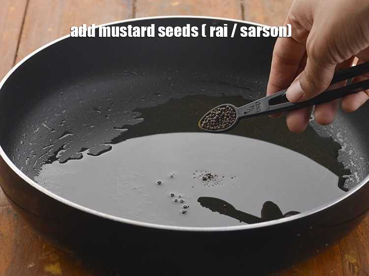 Step 2 – <p>Add <span style="background-color:rgb(255,255,255);color:rgb(0,0,0);">1/2 tsp </span><a href="https://www.tarladalal.com/glossary-mustard-seeds-sarson-rai-sarson-ke-beej-525i"><u>mustard seeds ( rai / sarson)</u></a><u>.</u></p>