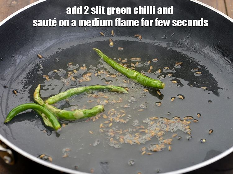Step 4 – <p>Add <span style="background-color:rgb(255,255,255);color:rgb(0,0,0);">2 </span><a href="https://www.tarladalal.com/glossary-slit-green-chillies-1856i"><u>slit green chilli</u></a><u>, </u><span style="background-color:rgb(255,255,255);color:rgb(0,0,0);">and sauté on a medium flame for …