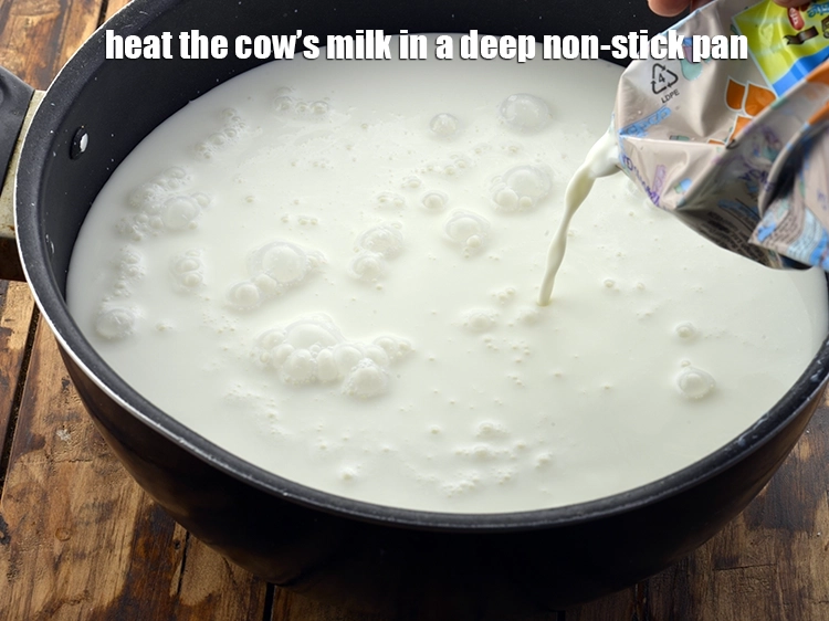 Step 8 – <p><span style="background-color:rgb(255,255,255);color:rgb(0,0,0);">Heat the 4 cups </span><a href="https://www.tarladalal.com/glossary-cows-milk-2686i"><u>cow's milk</u></a><span style="background-color:rgb(255,255,255);color:rgb(0,0,0);"> in a deep non-stick pan.</span></p>