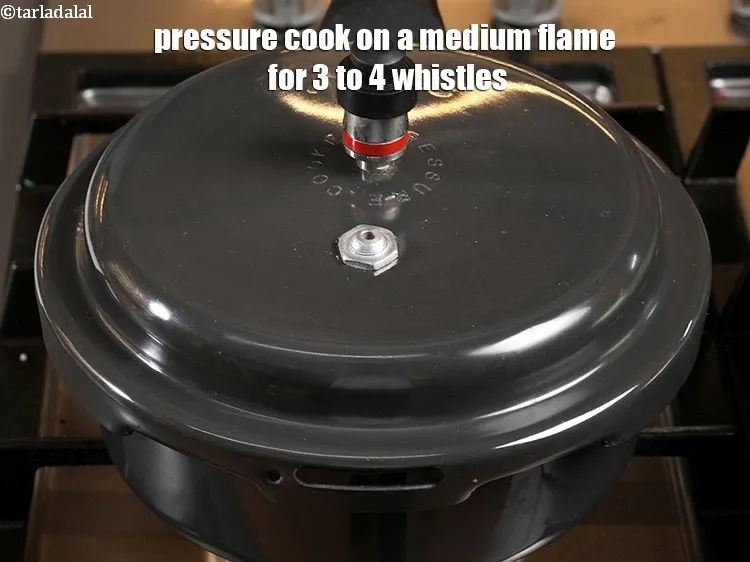Step 13 – <p>Pressure cook on a medium flame for 3 to 4 whistles.</p>