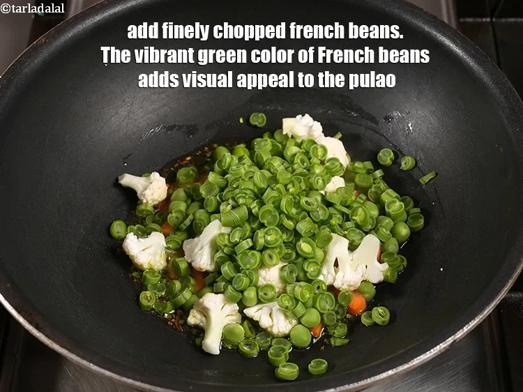 Step 17 – <p>Add ¼ cup finely <a href="https://www.tarladalal.com/glossary-chopped-french-beans-797i">chopped french beans</a>. The vibrant green color of French beans …