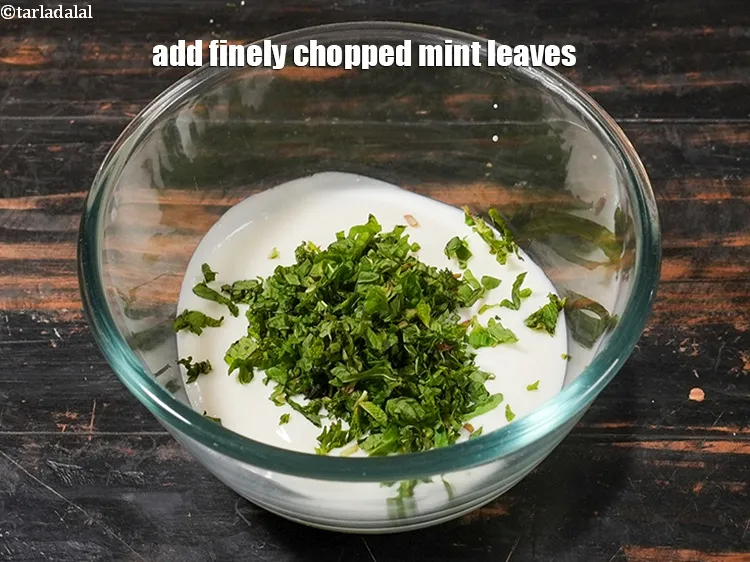 Step 4 – <p>Add 2 tbsp finely <a href="https://www.tarladalal.com/glossary-chopped-mint-788i">chopped mint leaves (phudina)</a>.</p>