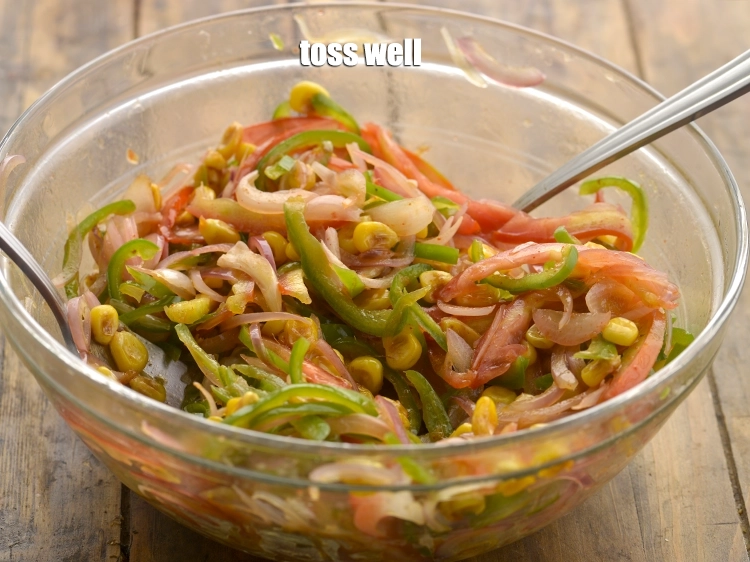 Step 21 – <p>Toss well and our <strong>burnt corn salad</strong>.</p>