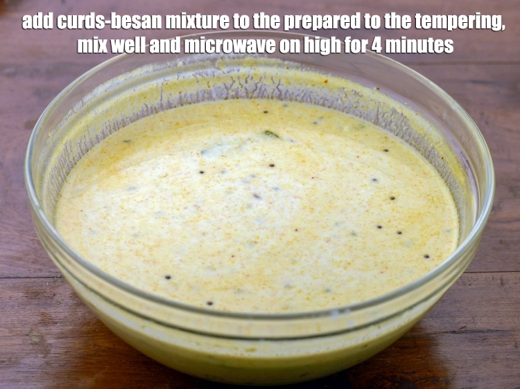 Step 7 – <p><span style="background-color:rgb(255,255,255);color:rgb(0,0,0);">Add the <strong>curds-besan mixture</strong> to the prepared to the tempering, mix well and microwave …