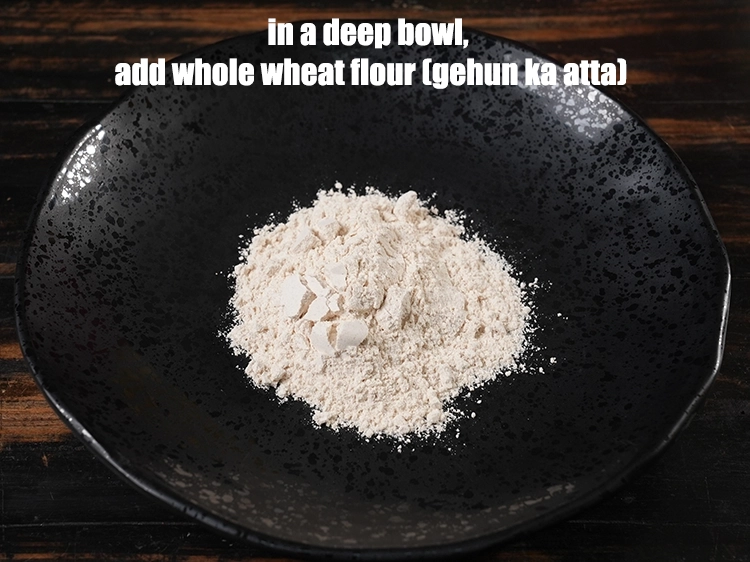 Step 2 – <p>In a deep bowl put <span style="background-color:rgb(255,255,255);color:rgb(0,0,0);">1/2 cup </span><a href="https://www.tarladalal.com/glossary-whole-wheat-flour-gehun-ka-atta-gehun-ka-aata-429i"><u>whole wheat flour (gehun ka atta)</u></a><u>.</u></p>
