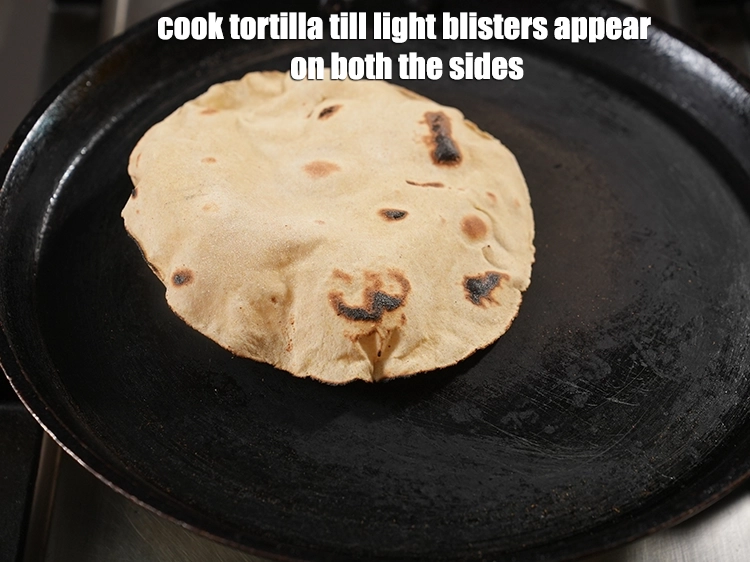 Step 13 – <p>Cook tortilla till light blisters appear on both the sides. Keep aside.</p>