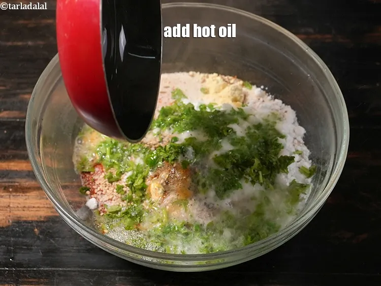 Step 35 – <p>Add 3 tbsp of hot oil in the batter.</p>