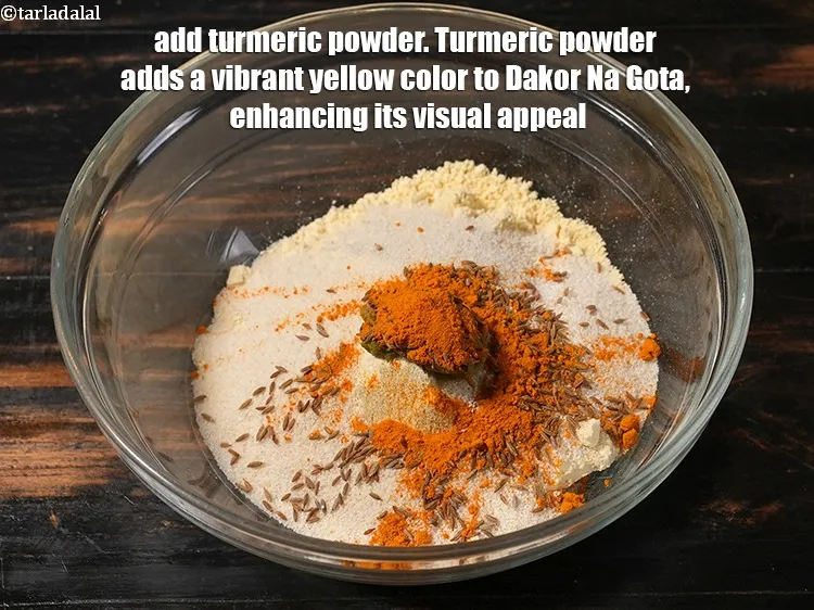Step 22 – <p>Add 1/2 tsp&nbsp;<a href="https://www.tarladalal.com/glossary-turmeric-powder-haldi-645i">turmeric powder (haldi)</a>. Turmeric powder adds a vibrant yellow color to Dakor …