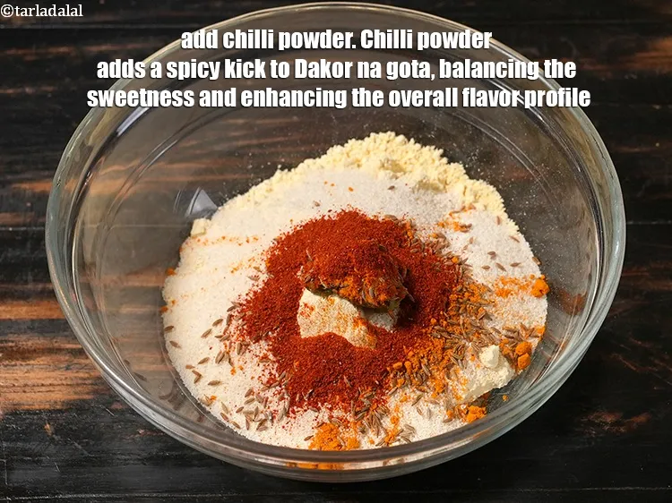 Step 23 – <p>Add 1 tsp <a href="https://www.tarladalal.com/glossary-chilli-powder-red-chilli-powder-339i">chilli powder</a>. Chilli powder adds a spicy kick to Dakor na …