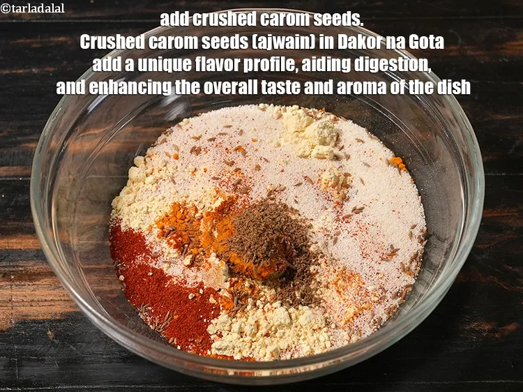 Step 24 – <p>Add ½ tsp crushed carom seeds. Crushed carom seeds (ajwain) in Dakor na Gota add …