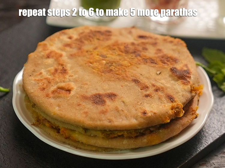 Step 62 – <p><span style="background-color:rgb(255,255,255);color:rgb(0,0,0);">Repeat steps 2 to 6 to make 5 more parathas.</span></p>