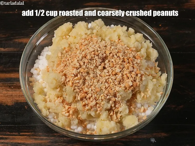 Step 25 – <p><span style="background-color:rgb(255,255,255);color:rgb(0,0,0);">Add 1/2 cup&nbsp;</span><a href="https://www.tarladalal.com/glossary-roasted-and-crushed-peanuts-1817i"><u>roasted and coarsely crushed peanuts</u></a><span style="background-color:rgb(255,255,255);color:rgb(0,0,0);">. See above on detailed method …