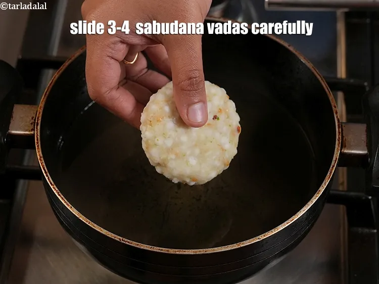 Step 34 – <p>Slide 3-4 &nbsp;<strong>sabudana vadas</strong>&nbsp;carefully. The number of vadas will depend upon the size of your …