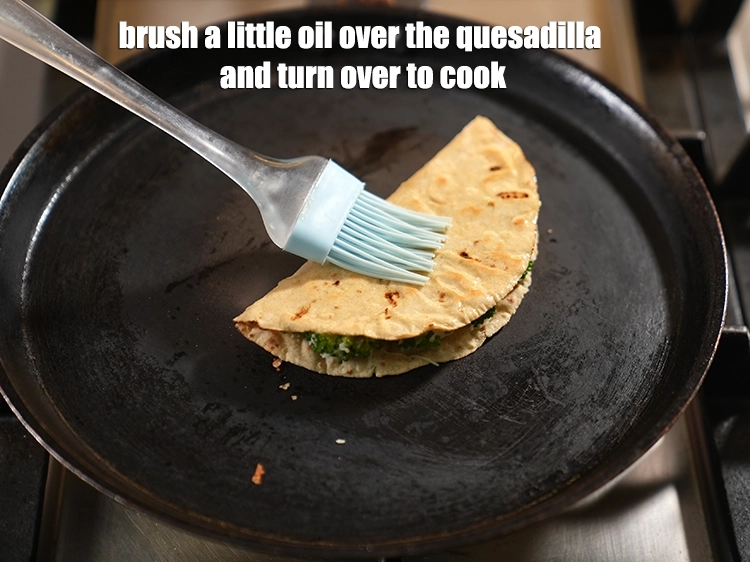 Step 16 – <p><span style="background-color:rgb(255,255,255);color:rgb(0,0,0);">Brush a little oil over the quesadilla and turn over to cook.</span></p>