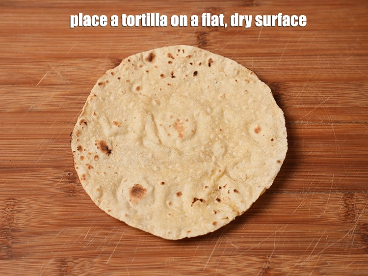 Step 10 – <p><span style="background-color:rgb(255,255,255);color:rgb(0,0,0);">Place a tortilla on a flat, dry surface.</span></p>