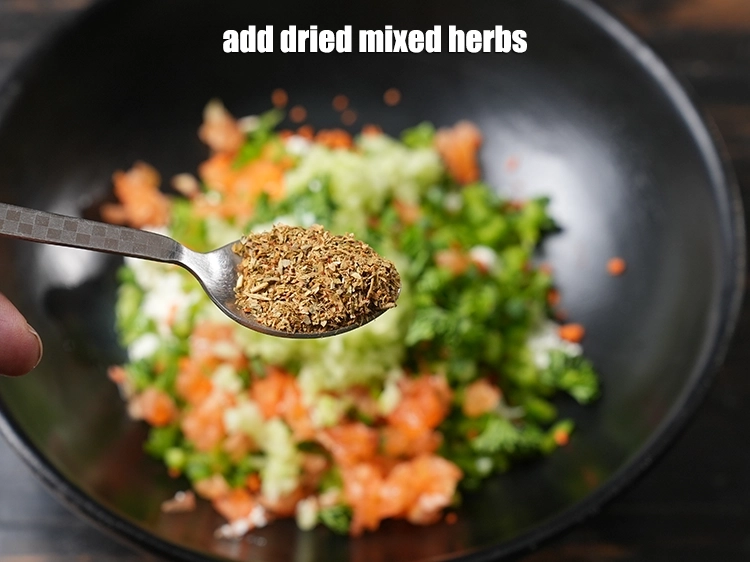 Step 11 – <p>Add <span style="background-color:rgb(255,255,255);color:rgb(0,0,0);">2 tsp </span><a href="https://www.tarladalal.com/glossary-dried-mixed-herbs-466i"><u>dried mixed herbs</u></a><u>.</u></p>
