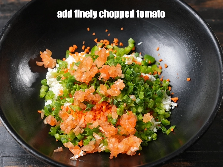 Step 7 – <p><span style="background-color:rgb(255,255,255);color:rgb(0,0,0);">Add 2 tbsp finely </span><a href="https://www.tarladalal.com/glossary-tomatoes-tamatar-639i#ing_2361"><u>chopped tomato</u></a>.</p>