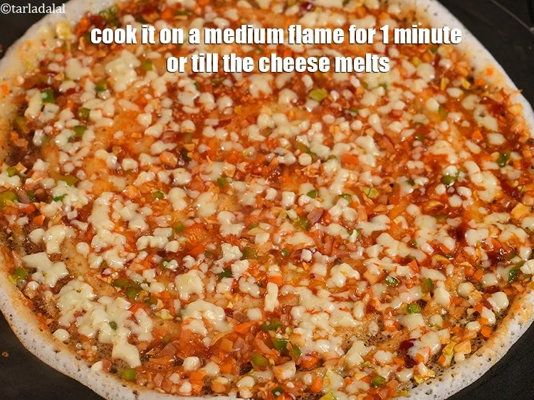 Step 14 – <p>Cook it on a medium flame for 1 minute or till the cheese melts.</p>