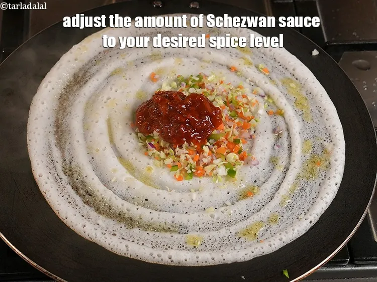 Step 17 – <p>Adjust the amount of <a href="https://www.tarladalal.com/glossary-Schezwan-sauce-Schezuan-sauce-1872i"><u>schezwan sauce</u></a> to your desired spice level.</p>