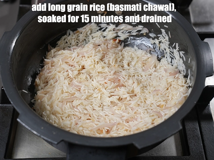Step 11 – <p>Add <span style="background-color:rgb(255,255,255);color:rgb(0,0,0);">1 1/2 cups </span><a href="https://www.tarladalal.com/glossary-long-grain-rice-basmati-chawal-basmati-rice-535i"><u>long grain rice (basmati chawal) </u></a><span style="background-color:rgb(255,255,255);color:rgb(0,0,0);">, soaked for …