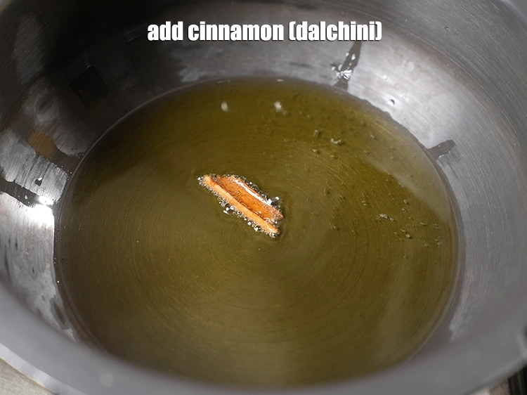 Step 3 – <p>Add <span style="background-color:rgb(255,255,255);color:rgb(0,0,0);">25 mm (1") </span><a href="https://www.tarladalal.com/glossary-cinnamon-dalchini-346i"><u>cinnamon (dalchini)</u></a><u>.</u></p>