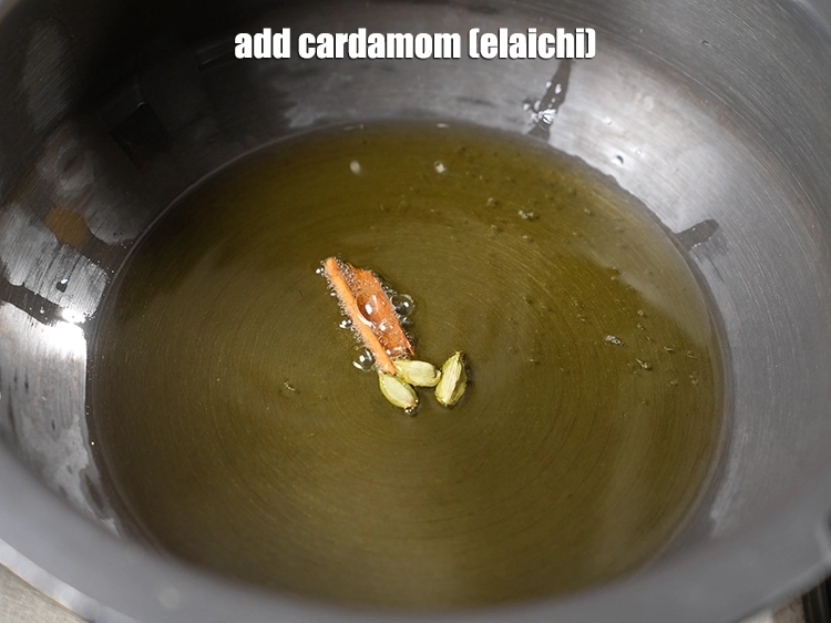 Step 4 – <p>Add <span style="background-color:rgb(255,255,255);color:rgb(0,0,0);">3 </span><a href="https://www.tarladalal.com/glossary-cardamom-elaichi-262i"><u>cardamom (elaichi)</u></a><u>.</u></p>